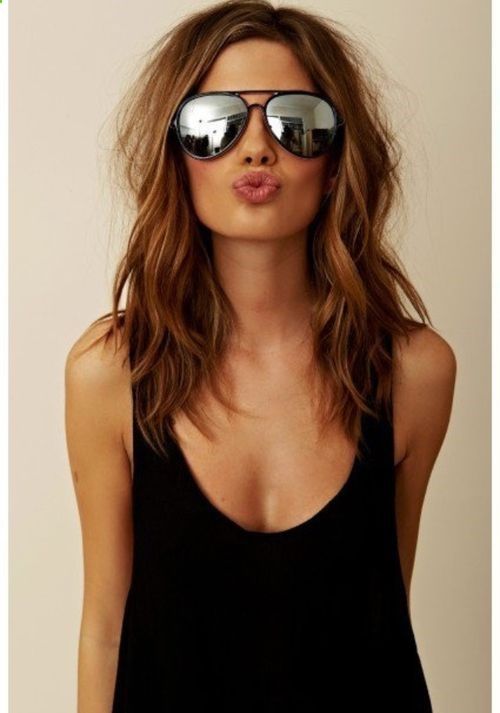 Brunette with aviator sunnies sunglasses and black tank