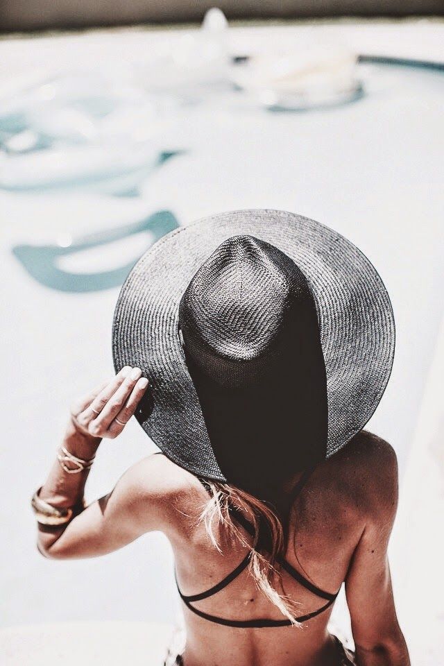 black bikini sun hat in water bikini babe