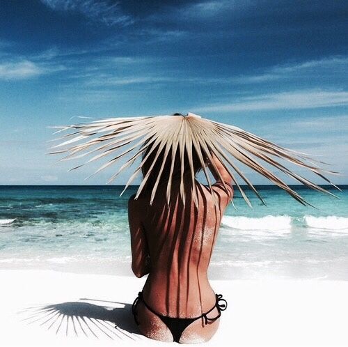 naked girl palm leaf hat beach