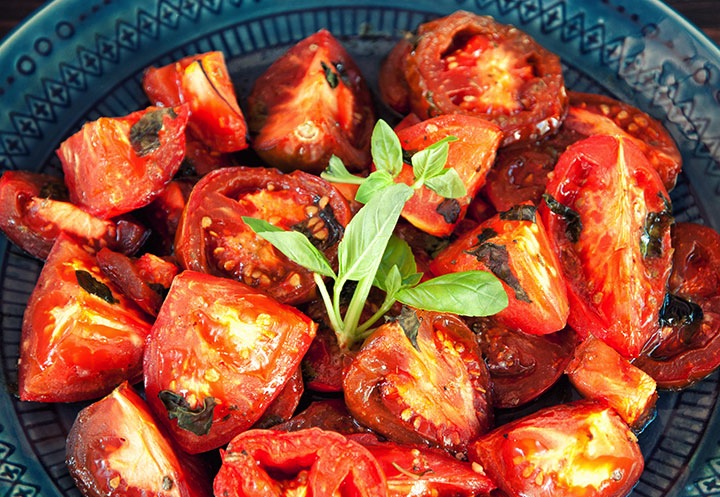 balsamic vinegar roasted tomatoes on blue plate